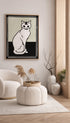 Modern living room with a framed black and white cat artwork on the wall.
